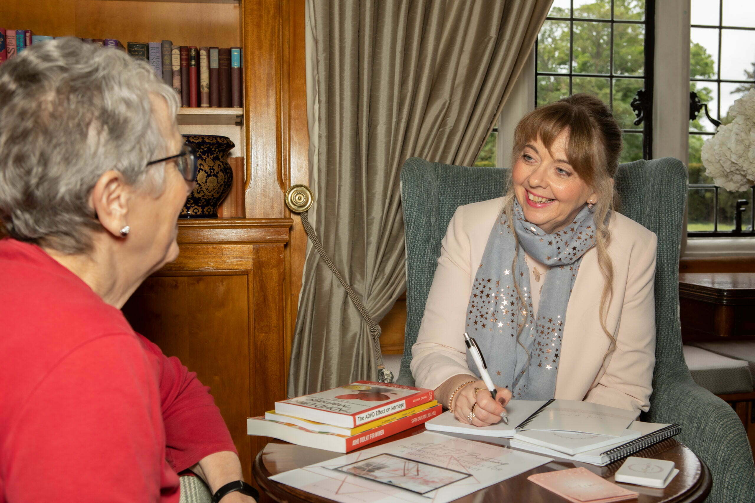 Image shows Leslie conducting a one to one coaching session with a client with ADHD